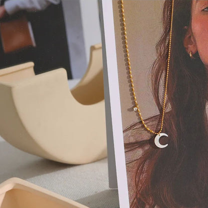 The Nganoú Necklace, 18K Gold Plated Stainless Steel with Shell Pendant in Geometric Design | The OÓ Jewels